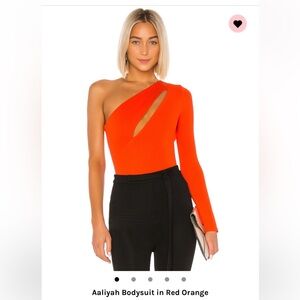 NBD revolve cut out top. Brown , shown in red on website size M bodysuit